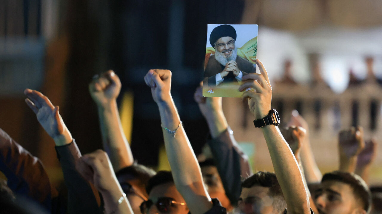 Hezbollah supporters gather at the site where the group's late leader Hassan Nasrallah was killed, in Lebanon