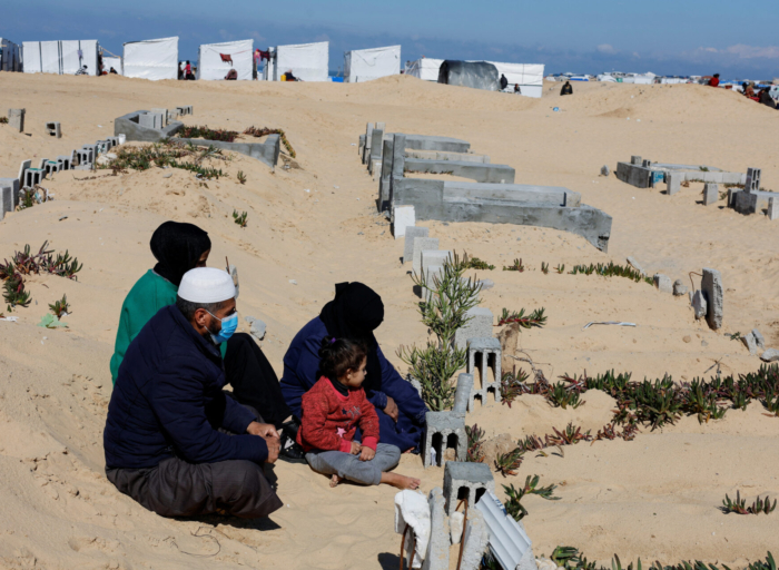 Displaced Palestinians shelter in a cemetery in Rafah in the southern Gaza Strip