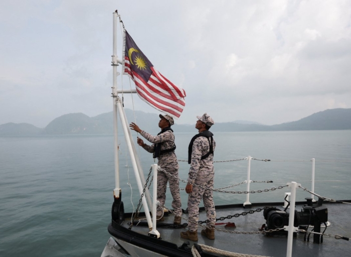 Malaysia rescues 23 migrants after boat capsizes, 14 still missing