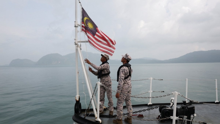 Malaysia rescues 23 migrants after boat capsizes, 14 still missing