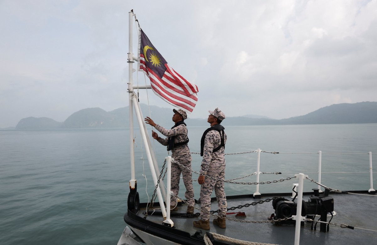 Malaysia rescues 23 migrants after boat capsizes, 14 still missing