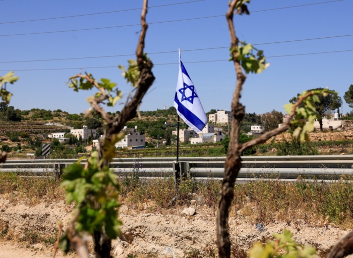 Israeli settlers force Palestinian family to exhume and rebury their father