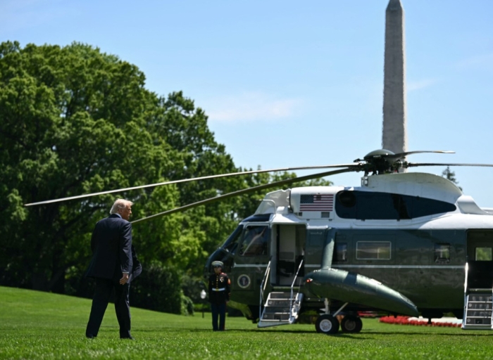 Trump downplays US Iran differences as he heads to Beijing to meet with Xi